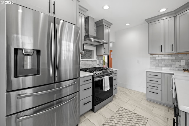 6959 N Denver Ave, Portland, OR 97217 - kitchen with stainless steel appliances, wall chimney range hood, gray cabinetry, light countertops, and recessed lighting