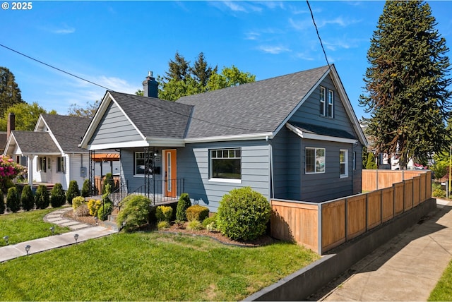 6959 N Denver Ave, Portland, OR 97217 - bungalow-style home with roof with shingles and a chimney