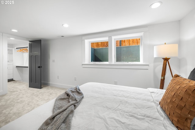 6959 N Denver Ave, Portland, OR 97217 - bedroom with recessed lighting, carpet floors, baseboards, and a walk in closet