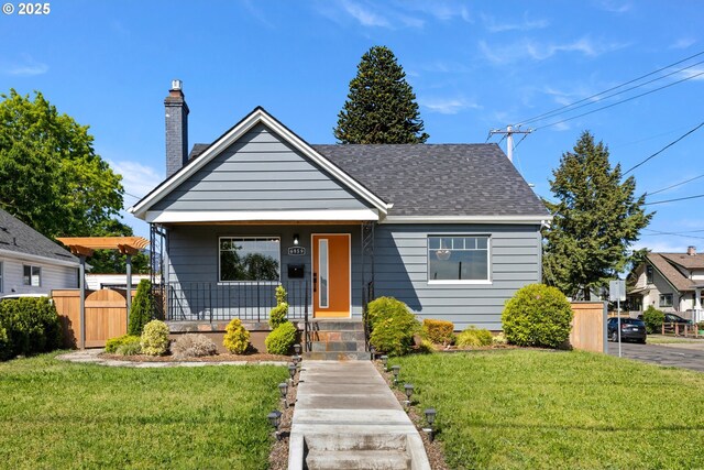 6959 N Denver Ave, Portland, OR 97217 - bungalow-style house with a chimney, roof with shingles, and covered porch