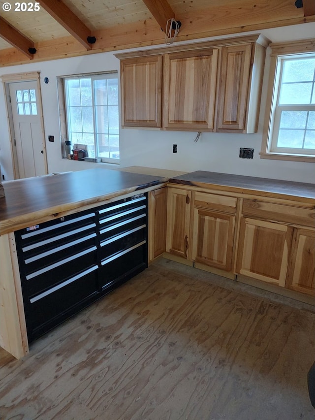 34376 State Highway 38, Scottsburg, OR 97473 - kitchen with beam ceiling, light wood-style floors, light brown cabinets, and plenty of natural light