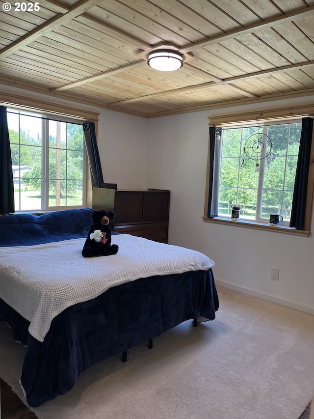 34376 State Highway 38, Scottsburg, OR 97473 - bedroom featuring wood ceiling, multiple windows, carpet flooring, baseboards, and ornamental molding
