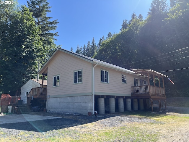 34376 State Highway 38, Scottsburg, OR 97473 - view of side of home featuring a wooden deck