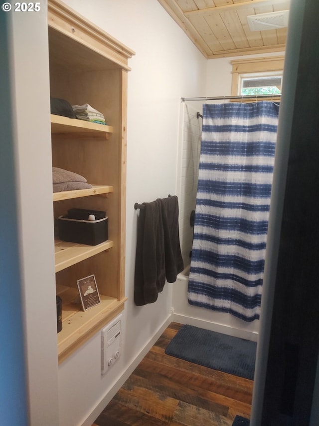 34376 State Highway 38, Scottsburg, OR 97473 - full bathroom featuring wood finished floors, shower / bath combo with shower curtain, wooden ceiling, and baseboards