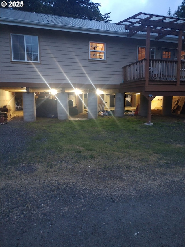 34376 State Highway 38, Scottsburg, OR 97473 - rear view of house with a deck, metal roof, and a yard