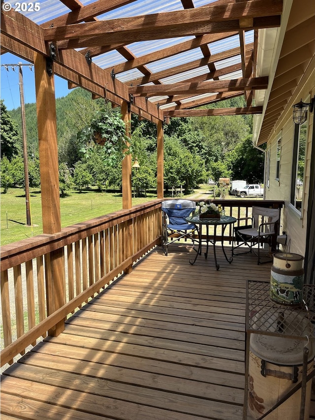 34376 State Highway 38, Scottsburg, OR 97473 - wooden terrace featuring a pergola, a yard, and view of wooded area