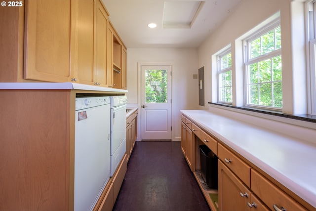 clothes washing area featuring cabinet space, washing machine and clothes dryer, recessed lighting, and electric panel
