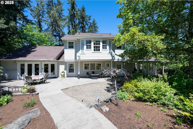 rear view of house featuring a patio area and french doors