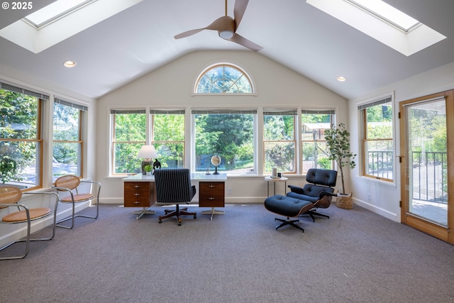 office area featuring a skylight, carpet, a ceiling fan, vaulted ceiling, and recessed lighting