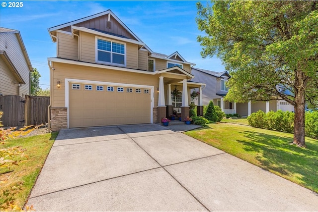 309 NW 150th Way, Vancouver, WA 98685 - craftsman inspired home featuring board and batten siding, an attached garage, stone siding, and driveway