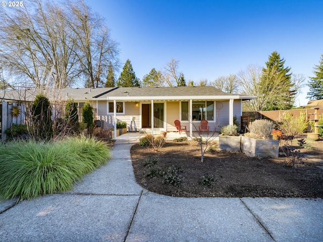 ranch-style house with covered porch