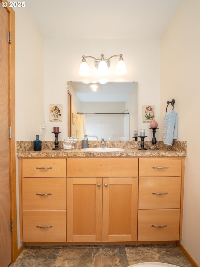 bathroom with vanity and a shower with shower curtain