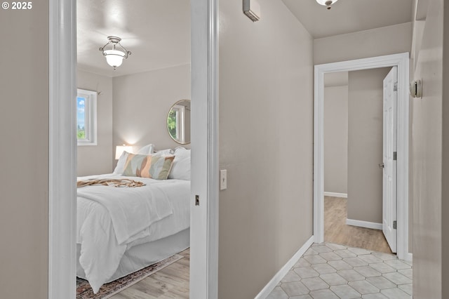 bedroom featuring baseboards