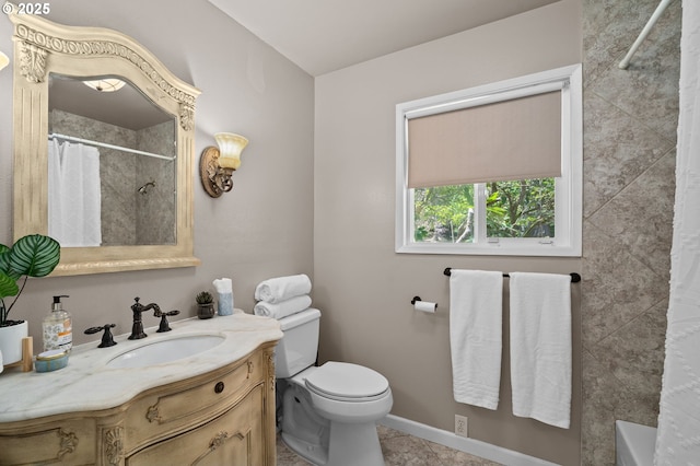 bathroom with a shower with shower curtain, toilet, vanity, tile patterned flooring, and baseboards
