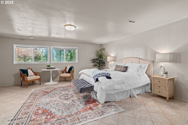 tiled bedroom featuring baseboards
