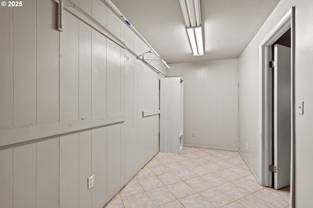 walk in closet featuring light tile patterned flooring