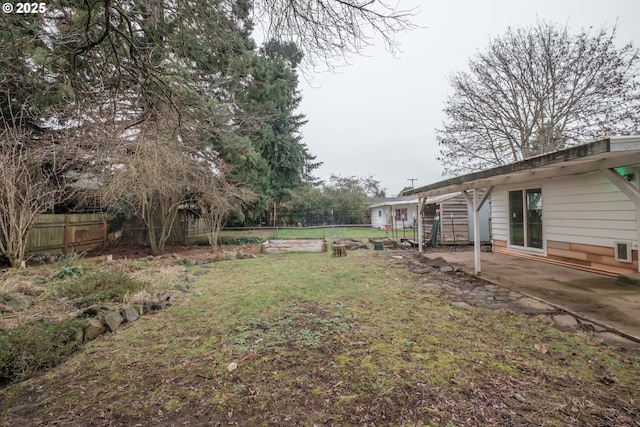 view of yard featuring a patio area and a fenced backyard