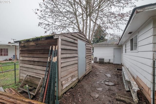 view of shed with fence