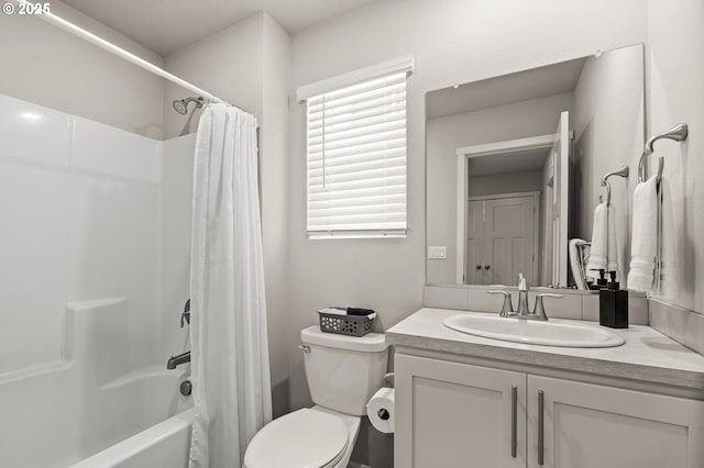 full bathroom with shower / bath combo with shower curtain, vanity, and toilet