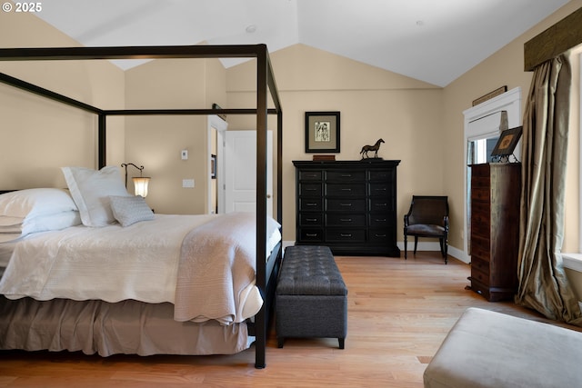 3563 Jake Mann Ln, Florence, OR 97439 - bedroom featuring lofted ceiling, light wood-style floors, and baseboards