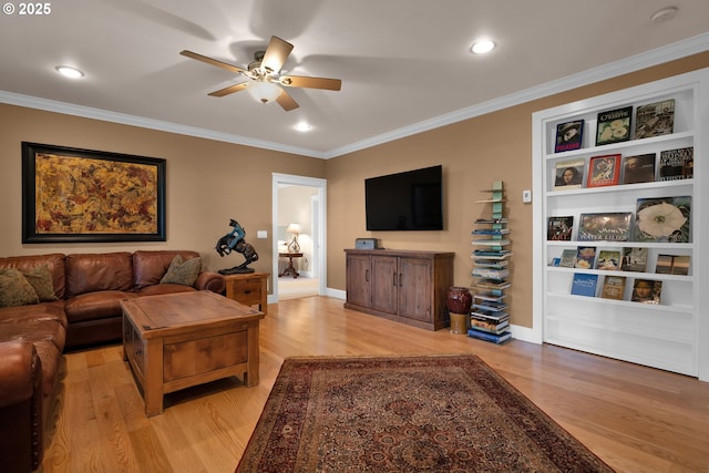 3563 Jake Mann Ln, Florence, OR 97439 - living room with a ceiling fan, light wood-style flooring, ornamental molding, recessed lighting, and baseboards
