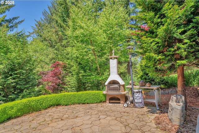 3563 Jake Mann Ln, Florence, OR 97439 - view of patio with an outdoor fireplace