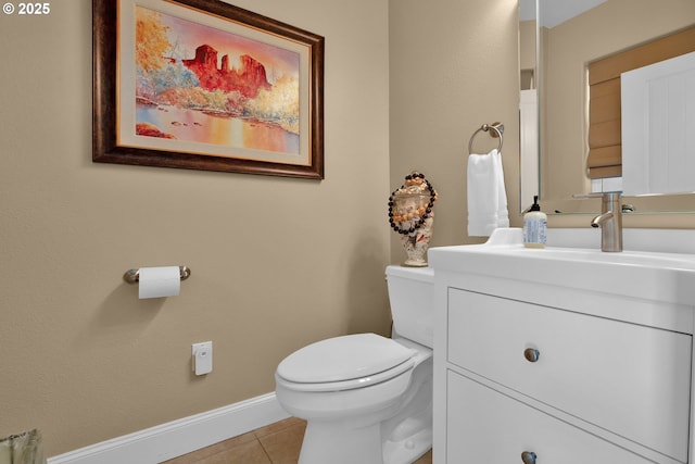 3563 Jake Mann Ln, Florence, OR 97439 - half bathroom with vanity, tile patterned floors, baseboards, and toilet