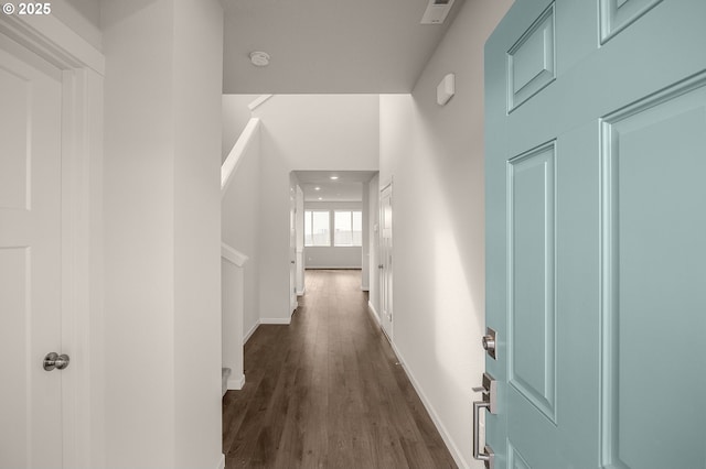 hallway featuring dark hardwood / wood-style flooring