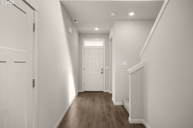 hall with dark hardwood / wood-style flooring