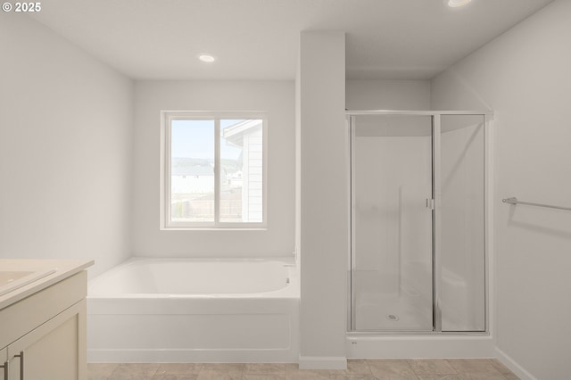 bathroom featuring vanity and plus walk in shower