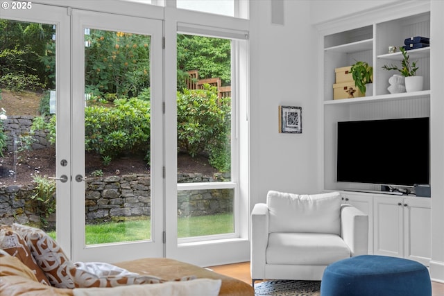 100 Garibaldi St, Lake Oswego, OR 97035 - living room featuring healthy amount of natural light, built in shelves, and wood finished floors