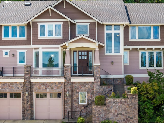 100 Garibaldi St, Lake Oswego, OR 97035 - townhome / multi-family property with stairs, a garage, stone siding, a shingled roof, and driveway