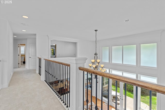 100 Garibaldi St, Lake Oswego, OR 97035 - hallway with a chandelier, plenty of natural light, recessed lighting, light carpet, and an upstairs landing