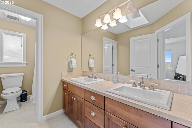 100 Garibaldi St, Lake Oswego, OR 97035 - bathroom featuring double vanity and tasteful backsplash