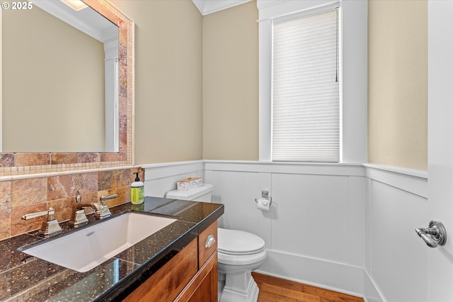 100 Garibaldi St, Lake Oswego, OR 97035 - half bathroom with wainscoting, vanity, and wood finished floors