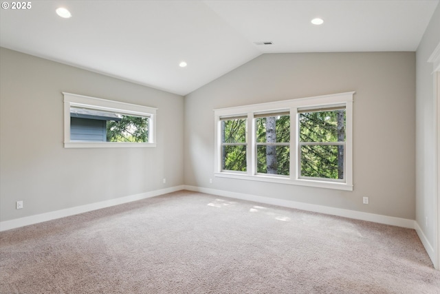 spare room with carpet, lofted ceiling, baseboards, and recessed lighting