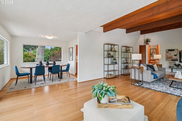 630 SW Viewmont Dr, Portland, OR 97225 - living room featuring light wood-style floors and beamed ceiling