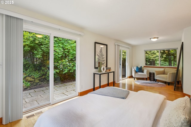 630 SW Viewmont Dr, Portland, OR 97225 - bedroom with access to exterior and wood finished floors