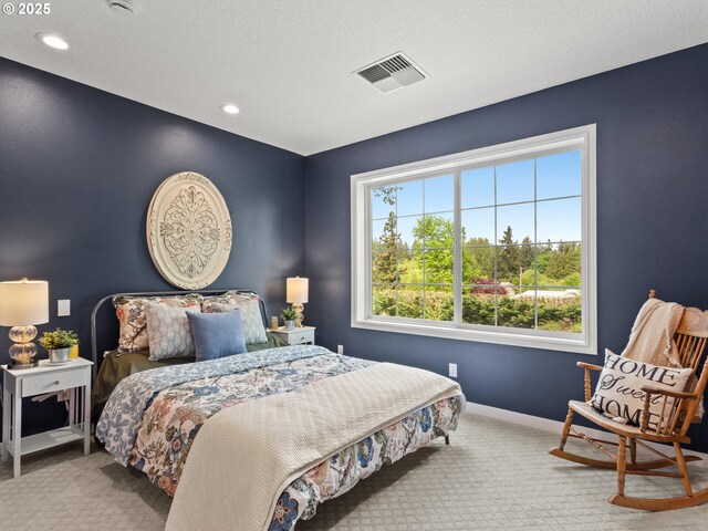 bedroom with carpet floors, baseboards, recessed lighting, and visible vents