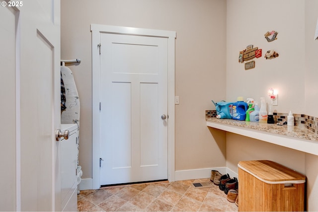 laundry room featuring baseboards and laundry area