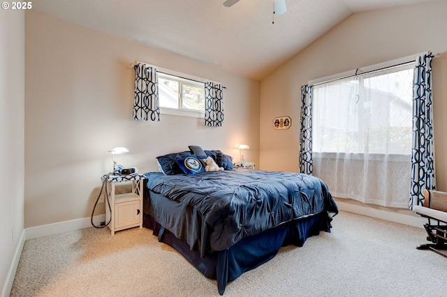 bedroom featuring baseboards, lofted ceiling, carpet floors, and a ceiling fan