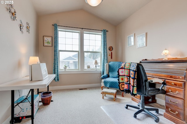 carpeted office with visible vents, baseboards, and lofted ceiling