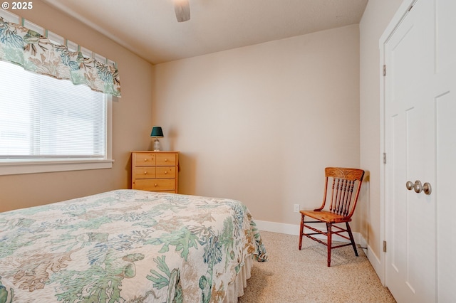 bedroom with baseboards and ceiling fan