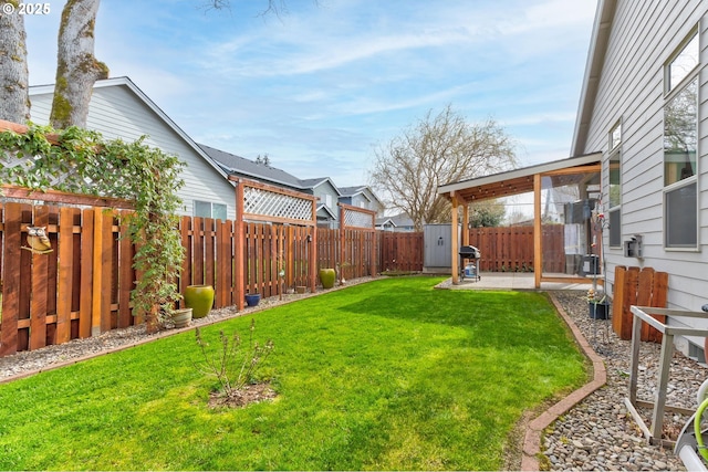 view of yard with a fenced backyard and a patio area