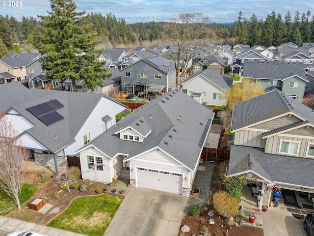 birds eye view of property with a residential view