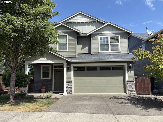 4002 N 3rd Cir, Ridgefield, WA 98642 - craftsman inspired home featuring board and batten siding, driveway, stone siding, a garage, and roof with shingles