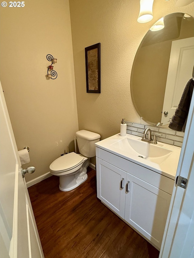 4002 N 3rd Cir, Ridgefield, WA 98642 - bathroom featuring vanity, toilet, wood finished floors, and baseboards