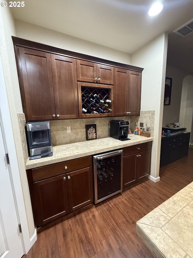 4002 N 3rd Cir, Ridgefield, WA 98642 - bar area featuring beverage cooler, dark wood finished floors, backsplash, baseboards, and arched walkways