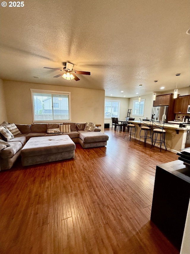 4002 N 3rd Cir, Ridgefield, WA 98642 - living room featuring light wood-type flooring, ceiling fan, and a textured ceiling