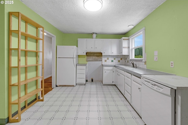 10303 SE Bull Run Rd, Corbett, OR 97019 - kitchen featuring white appliances, a textured ceiling, light floors, white cabinetry, and light countertops